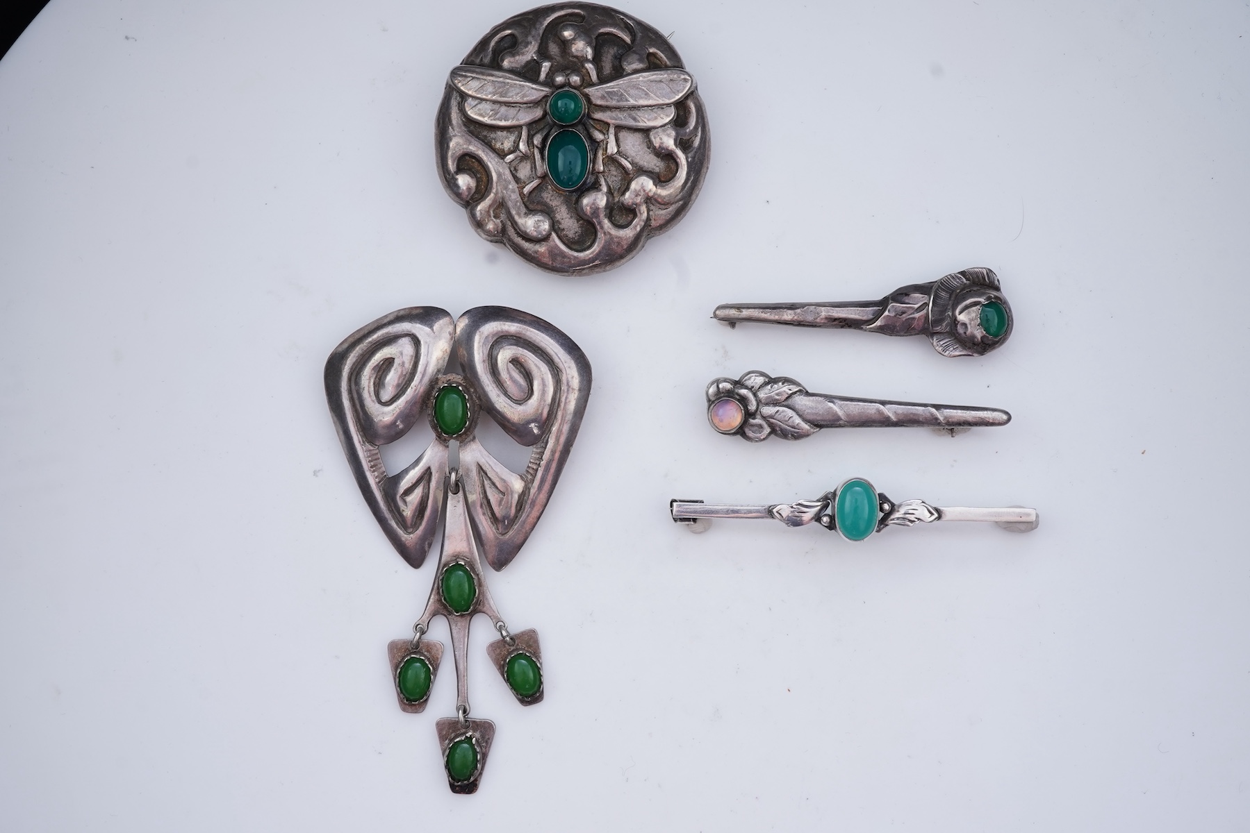 A collection of five Arts & Crafts silver brooches, Denmark, early-mid 20th century